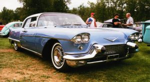 1958 Cadillac Eldorado Brougham in Lake Placid Blue with chromed aluminum cast wheels, panoramic windshield, suicide doors and stainless steel roof. This ultimate Cadillac was the most expensive car built in America with a price of $13,074!